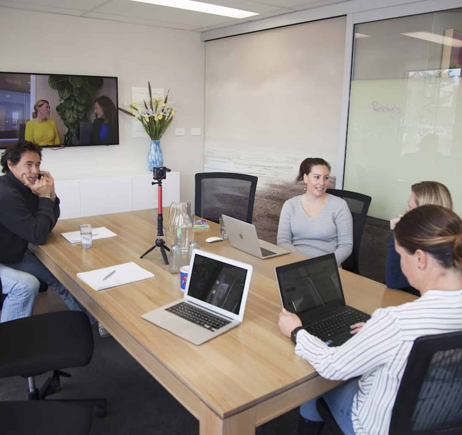 Team meeting in a modern conference room.