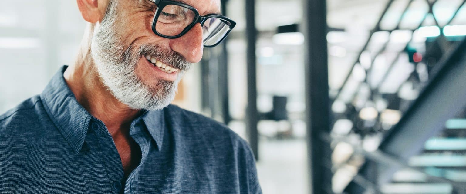 elderly-man-wearing-glasses-smiling