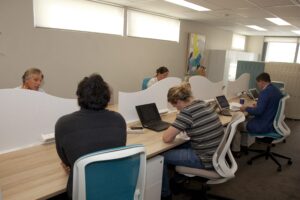 People working in a shared office space.